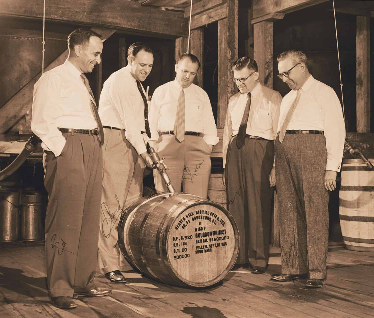 historic signed photo of the five Shapira brothers filling a barrel