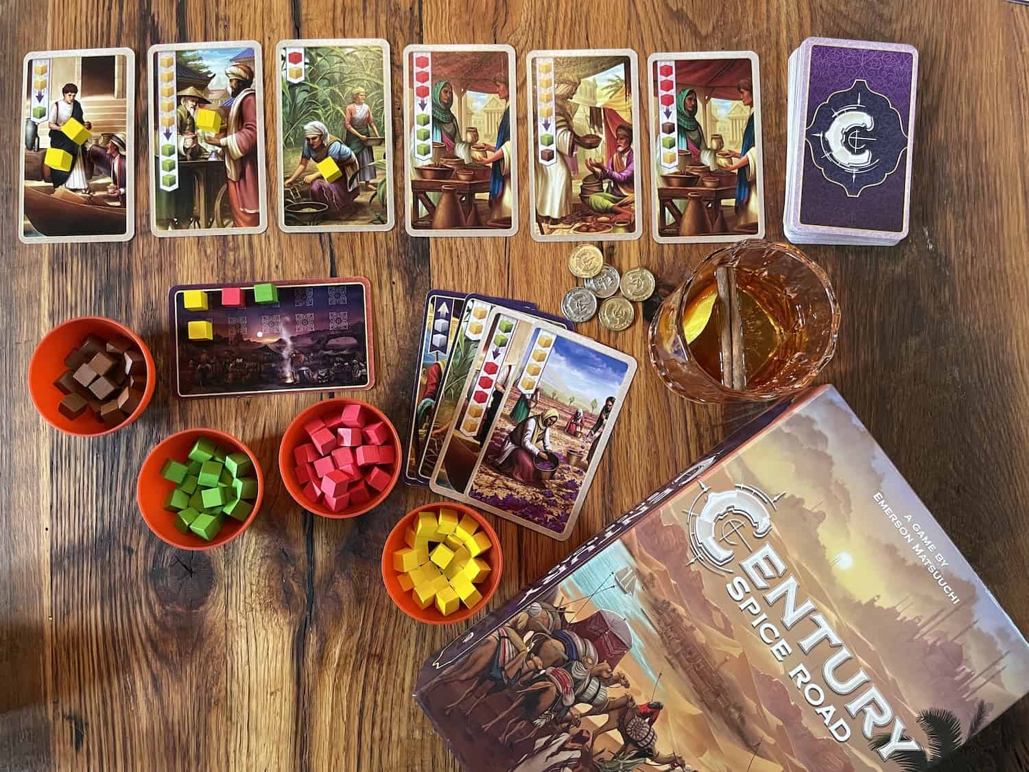 board game Century Spice Road and a cinnamon old fashioned cocktail