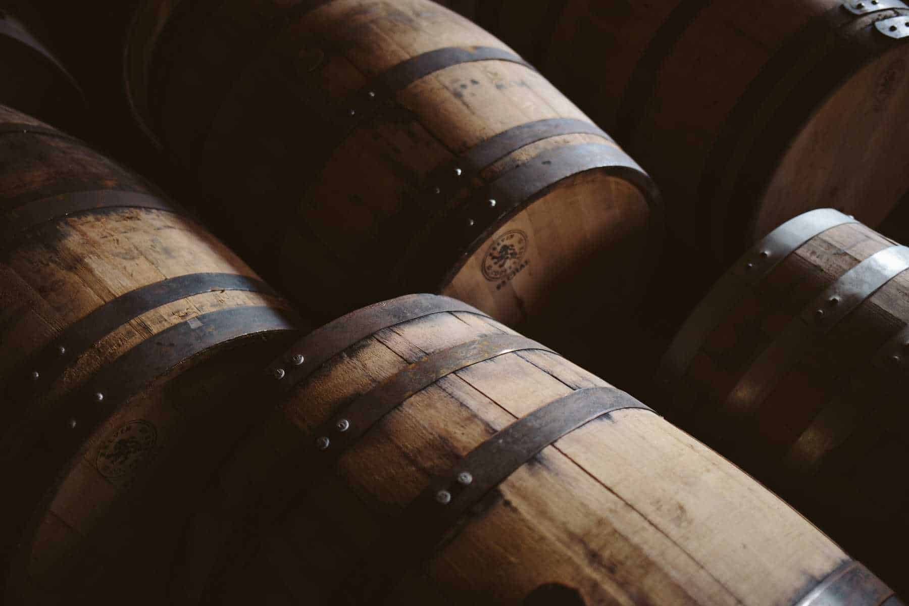 barrels on their sides in the shadows